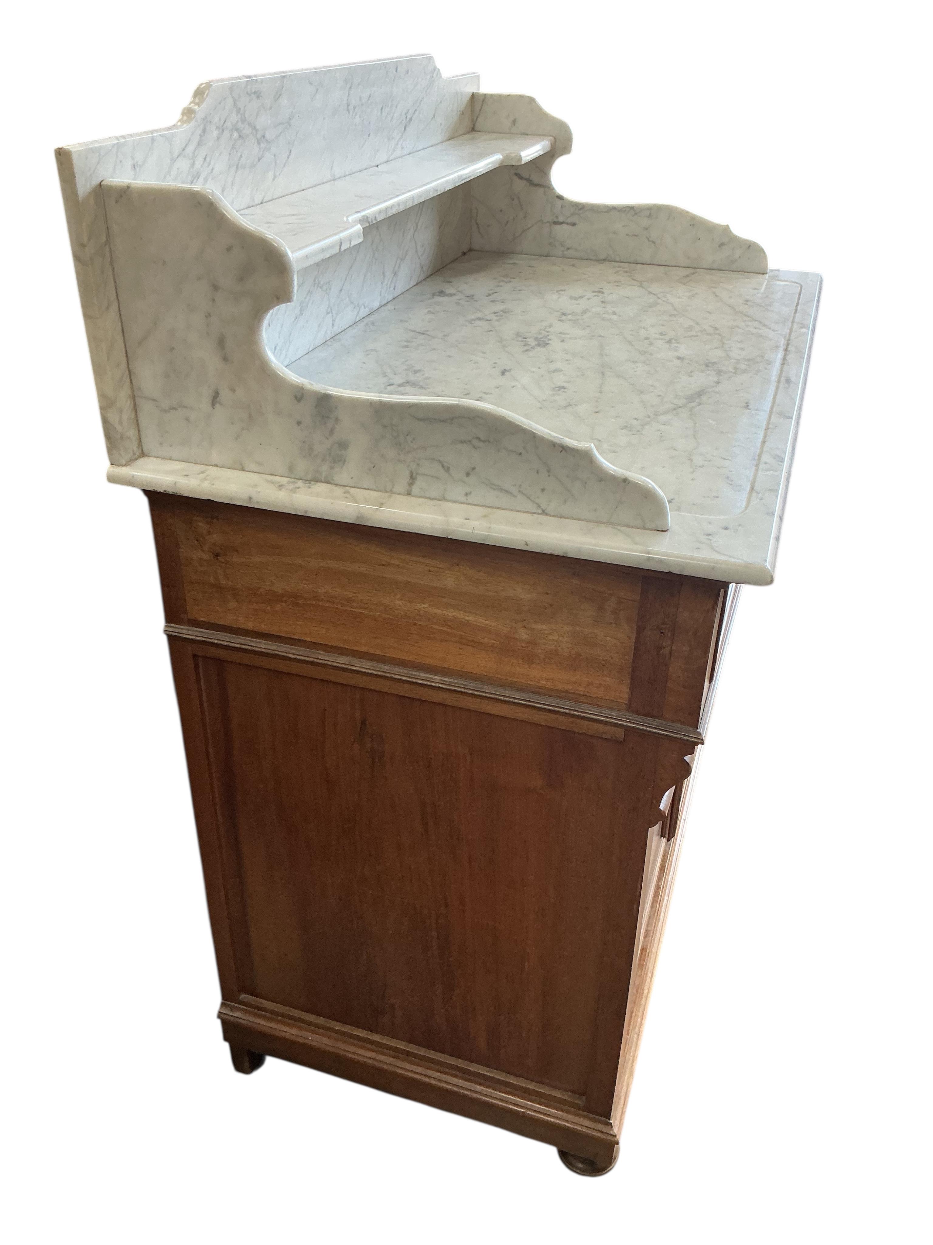 An early 20th century French marble top mahogany washstand, width 100cm, depth 56cm, height 110cm